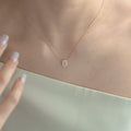 K18 EMERALD CUT DIAMOND HALO NECKLACE