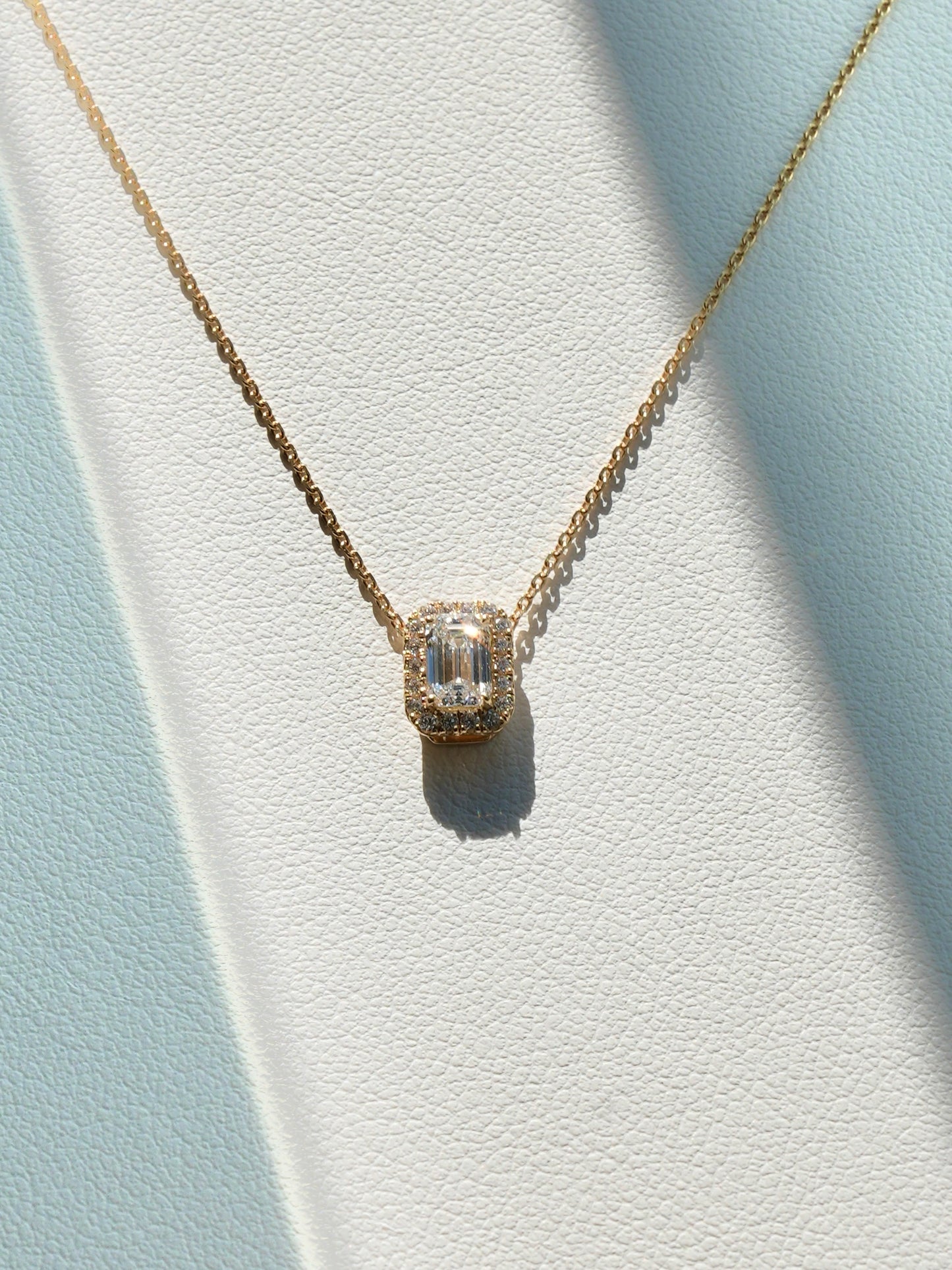 K18 EMERALD CUT DIAMOND HALO NECKLACE